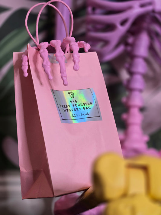 $10 TREAT YOURSELF MYSTERY BAG • $25 VALUE